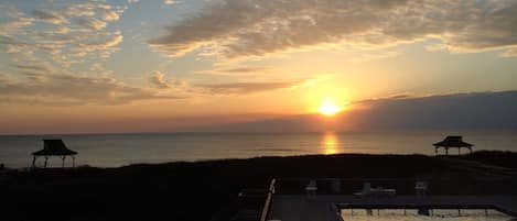 Sunrise over the Atlantic from your own private beach front balcony.