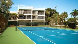 Tennis, anyone? This pristine court awaits. Forgot rackets? We've got plenty!