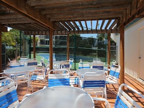Enjoy lunch or a page-turner beach read on the pool deck w Showers + Bathrooms