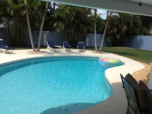Pool with 5 lounge chairs.