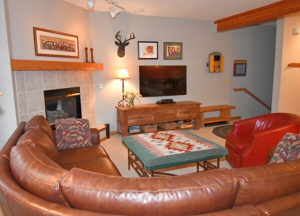 Generous comfortable seating and large screen TV.