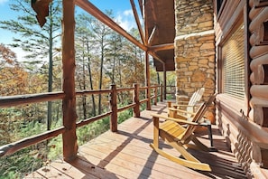 Find your inner peace on this private deck overlooking the forest.