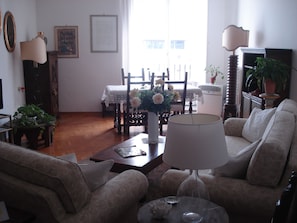 Parquet flooring and light colored living room