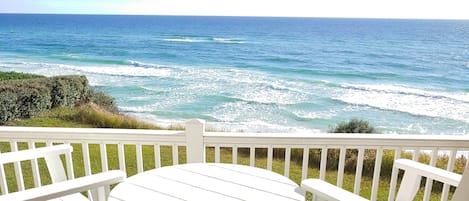 Family room balcony view. Seating for 4. Steps from balcony lead to beach steps