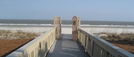 Cross over the dunes to the beach on the Villamare private walkway.