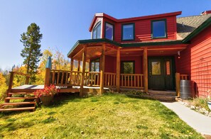 Front door and side of deck in the yard.