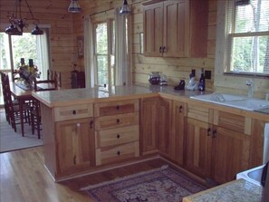 Hickory kitchen with granite counters.