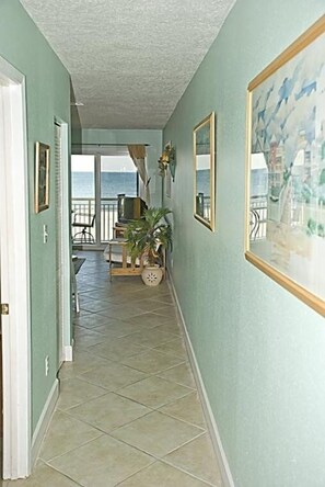 ENTRY HALL AND PARTIAL VIEW OF LIVING AREA, BALCONY, AND GULF OF MEXICO - 2009
