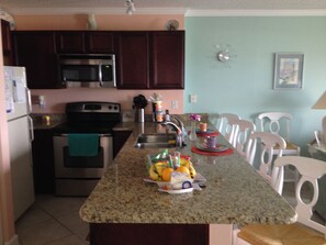 VIEW OF KITCHEN WITH GRANITE COUNTERS AND CHERRY CABINETS - 2015.

