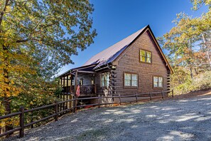 Back of cabin...entrance.  Can park 4 cars here in the driveway.