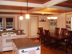 We have a large kitchen with breakfast bar and seating for eight at the table