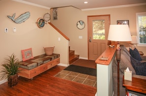 LIVING ROOM WITH STAIR ACCESS TO UPPER LEVEL