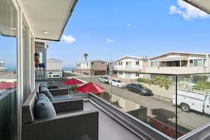 Enjoy ocean views and ocean breezes on the front balcony any time of the year. Front main house.