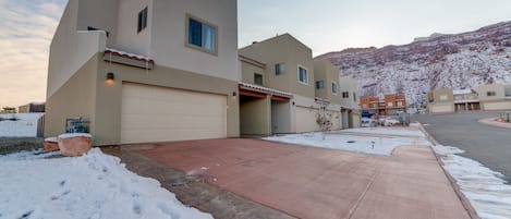 Driveway for 2 large vehicles plus 2 medium size car parking in garage.