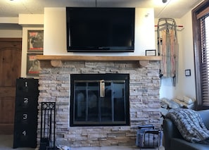 Family Room with Flat Panel TV above Mantel - Games in cabinet