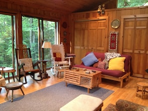 Spacious living room with large glass windows.
