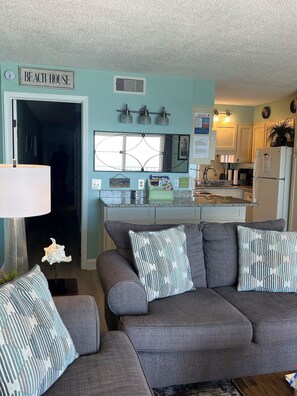 Quick view behind sofa/loveseat down hallway from family/living area 