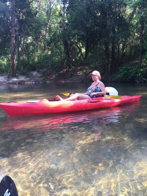 Kayaking up the river where the water is spring fed.