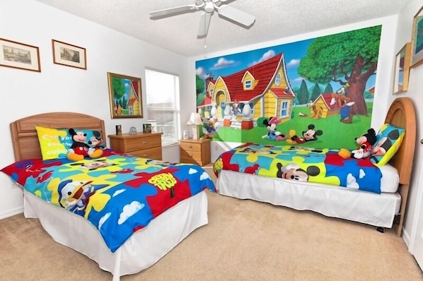 Disney themed kids room. 2 twin beds. with attached bathroom