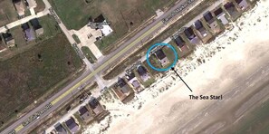 Google Earth shows house location on the beach.