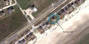 Google Earth shows house location on the beach.