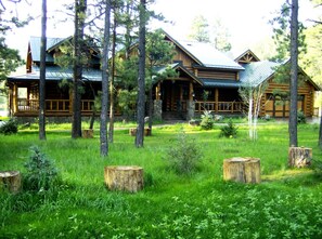 View of the front of the cabin. Includes 2 car garage.