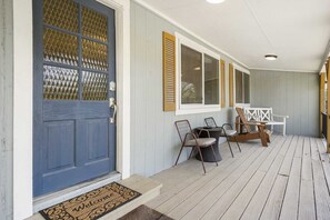 Step onto the cozy front porch at Hidden Maple - perfect for morning coffee or relaxing evenings.