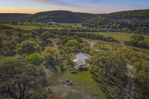 Secluded hill country escape at Hidden Maple - your serene retreat surrounded by nature and stunning sunset views.
