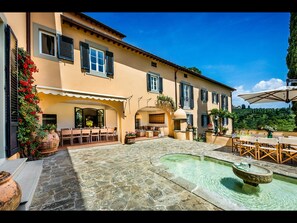 Villa's courtyard with water fountain