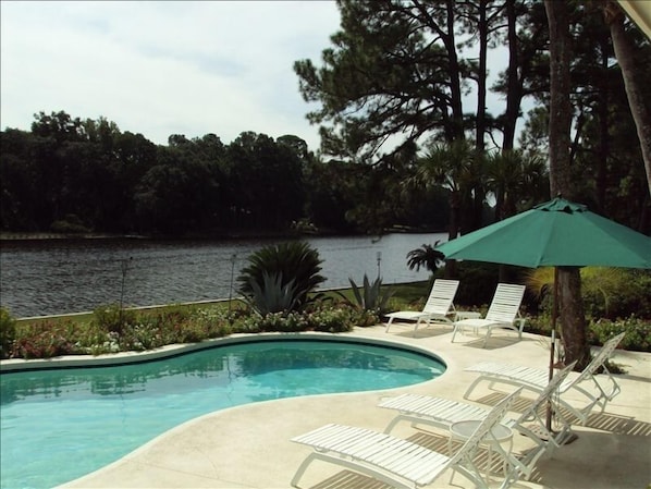 Enjoy private pool & yard, beautifully landscaped, seats 7 with charcoal grill