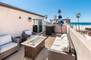 Upstairs BBQ deck with refrigerator and ice maker