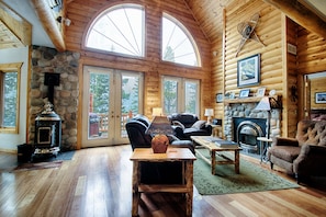 Stunning Denali great room with gas fireplace, pellet stove, deck access & 3D TV