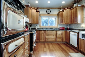 Kitchen: 3 ovens, warming drawer, granite counters, Asko dishwasher, cherry flrs