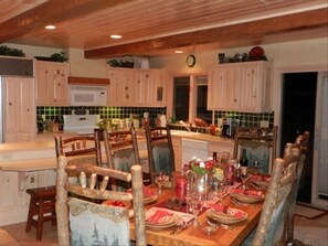 Lovely custom kitchen with sub zero frig, convection oven, breakfast bar, views