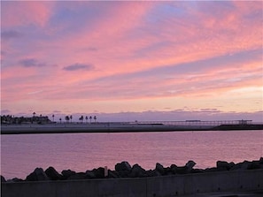 View from our front door, sunset over the Jetty and Ocean Beach Pier