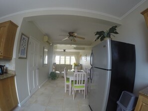 Dining area and living room as seen from kitchen.