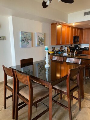 Large dining table that accommodates 8 and spacious kitchen area