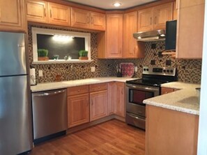 New stainless steel appliances with a fully equipped kitchen