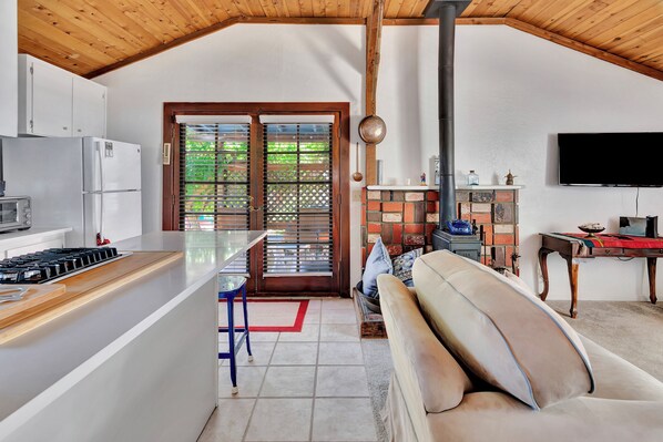 French doors go to patio off of kitchen and living room. Wood burning stove.