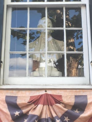 Statue of George Washington in front window