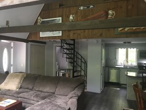 Living room, kitchen , spiral stairs view 