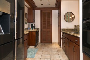 Granite counters, mahogany cabinets, doors and trim