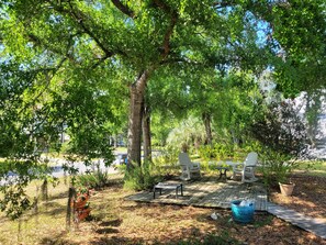 Enjoy the shade of large Oak trees in the front yard