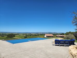 20 by 40 foot infinity pool with sunken hot tub overlooking the wine country