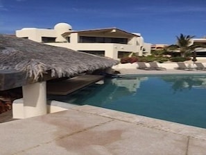 Enjoy a cold one at the Palapa bar pool, you don't even have to leave the water!