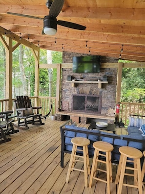 Outdoor Pavilion w/wood burning fireplace, sectional, rocking chairs,  SmartTV