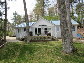 Back of house lake side, with deck, gas BBQ, Table and 4 chairs, 4 extra chairs