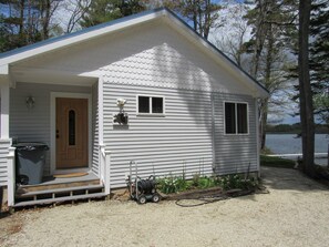Front of cottage, Lake is in the rear, flat and level to the lake, 40' away