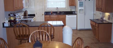 Fully appointed kitchen with granite counters. Just bring your favorite foods