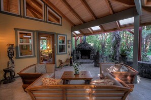 The Lanai Living Room features a 
handbuilt lavarock fireplace for warmth